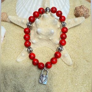 Beaded bracelet-red howlite beads with silver tone accents and lock charm